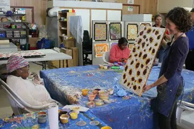 Amandine Caire assisting Lilly Ulah in a workshop