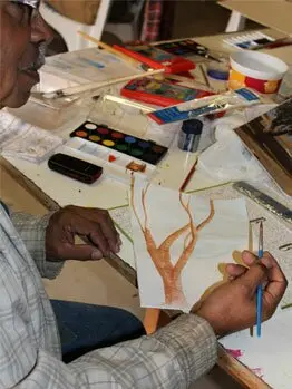 George Cooley working on his tree painting technique