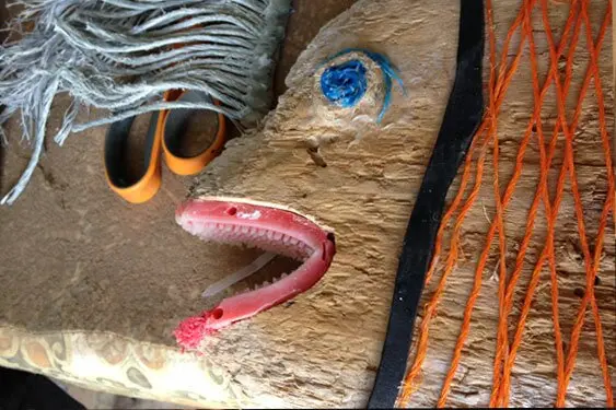 Estelle Miller is making this snapper from driftwood, floating nylon string and a washed up brush.