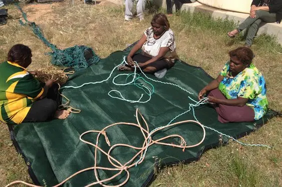 Yalata artists working with some of the rope that washed up on the beaches.